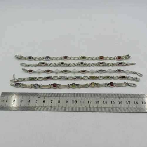 Lot of 5 silver look alike bracelets with colored stones - never used