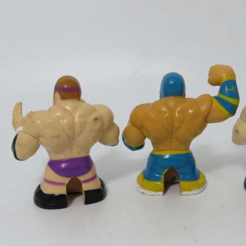 Set of 4 Wicked cool WWE wrestling Thumbpers figurines