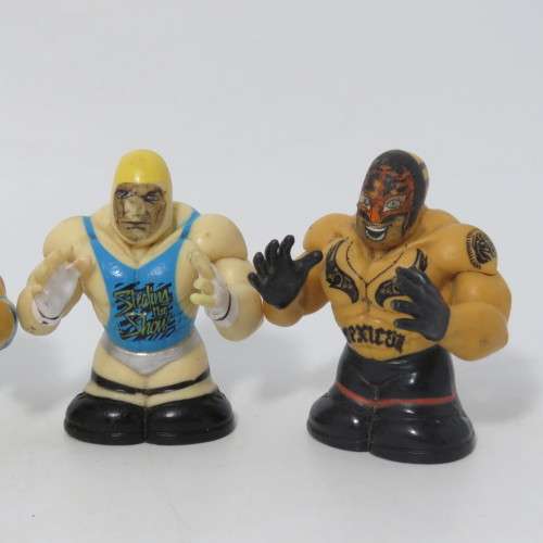 Set of 4 Wicked cool WWE wrestling Thumbpers figurines