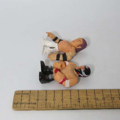 Lot of 4 WWE Rumblers figurines