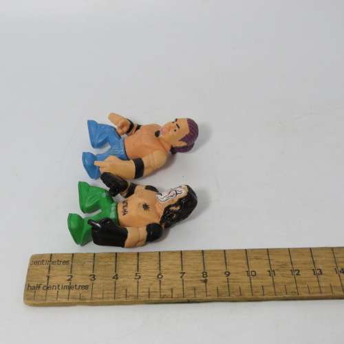 Lot of 4 WWE Rumblers figurines