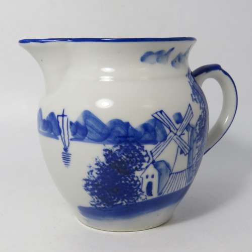 Antique hand painted porcelain milk jug