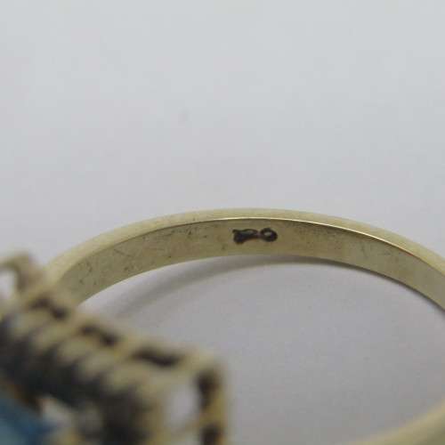 9kt Gold ring with 3.5ct blue topaz and small diamonds of 0.28ct in total - weighs 4.8g - size O/7