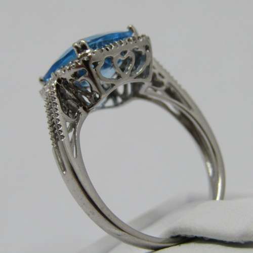 9kt Gold ring with blue Topaz and small diamonds of 0.13ct - weighs 3.5g - size N/7 - new never worn