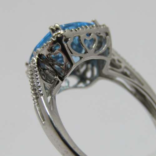 9kt Gold ring with blue Topaz and small diamonds of 0.13ct - weighs 3.5g - size N/7 - new never worn