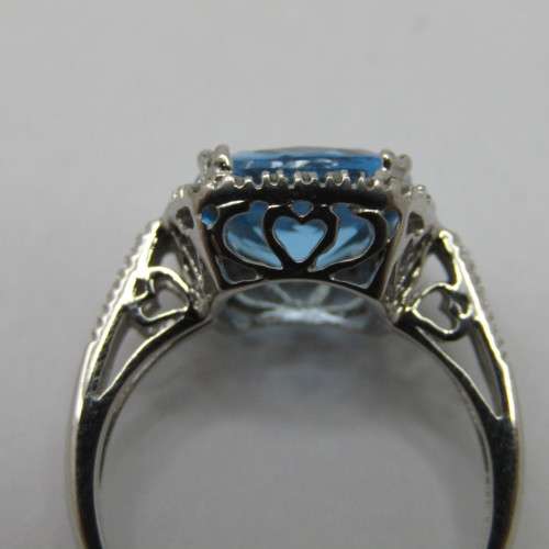 9kt Gold ring with blue Topaz and small diamonds of 0.13ct - weighs 3.5g - size N/7 - new never worn