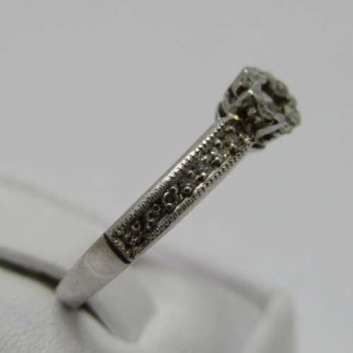 9kt White Gold diamond ring with 0.10ct diamond and smaller 0.15ct in total - weighs 2.2g - size L/6