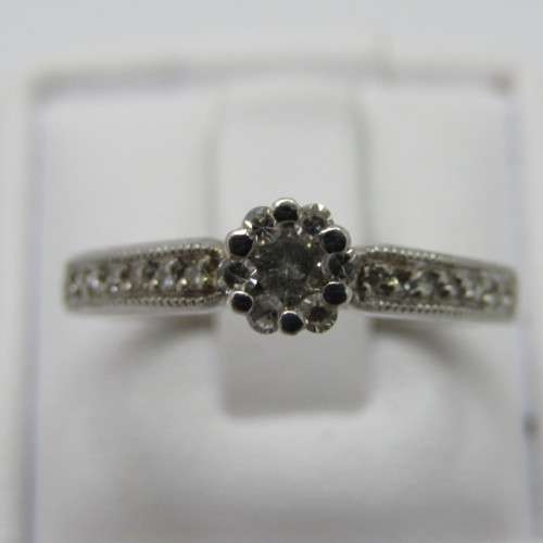 9kt White Gold diamond ring with 0.10ct diamond and smaller 0.15ct in total - weighs 2.2g - size L/6