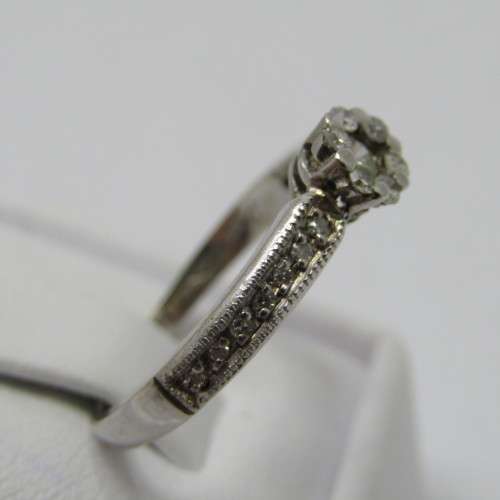 9kt White Gold diamond ring with 0.10ct diamond and smaller 0.15ct in total - weighs 2.2g - size L/6