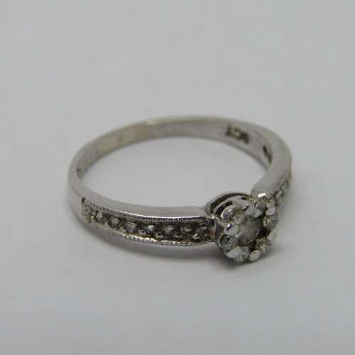 9kt White Gold diamond ring with 0.10ct diamond and smaller 0.15ct in total - weighs 2.2g - size L/6