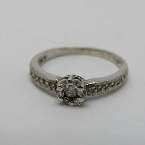 9kt White Gold diamond ring with 0.10ct diamond and smaller 0.15ct in total - weighs 2.2g - size L/6
