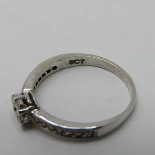 9kt White Gold diamond ring with 0.10ct diamond and smaller 0.15ct in total - weighs 2.2g - size L/6
