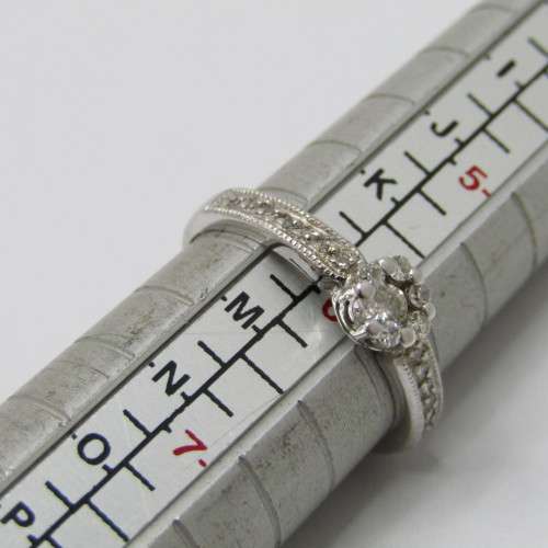 9kt White Gold diamond ring with 0.10ct diamond and smaller 0.15ct in total - weighs 2.2g - size L/6