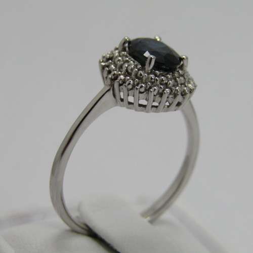 9kt Gold ring with blue sapphire and 8 small diamonds - weighs 2.6g - size M/7