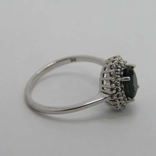 9kt Gold ring with blue sapphire and 8 small diamonds - weighs 2.6g - size M/7