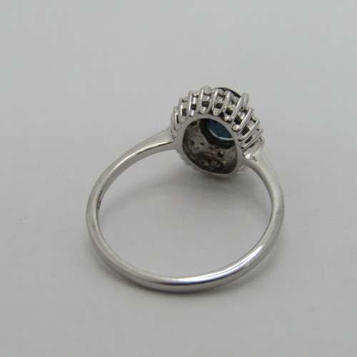 9kt Gold ring with blue sapphire and 8 small diamonds - weighs 2.6g - size M/7
