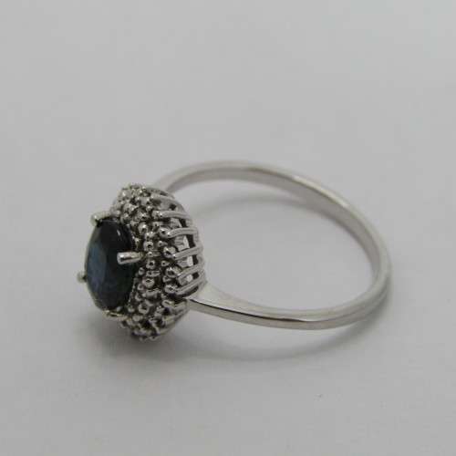 9kt Gold ring with blue sapphire and 8 small diamonds - weighs 2.6g - size M/7