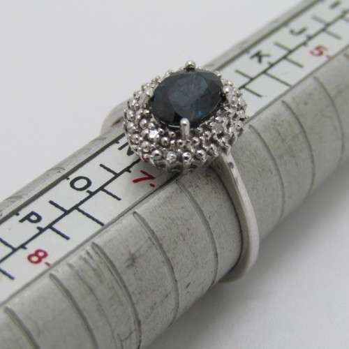 9kt Gold ring with blue sapphire and 8 small diamonds - weighs 2.6g - size M/7