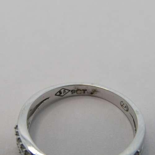 9kt White gold diamond ring with 0.11ct diamond and small diamonds of 0.25ct in total