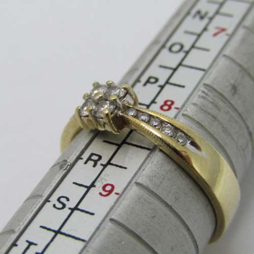 9kt gold ring with 14 small diamonds of about 0.25ct in total - weighs 2.9g - size Q/8