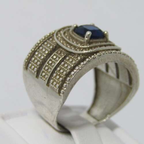 Sterling Silver ring with blue stone - weighs 7.5g - size Q/8