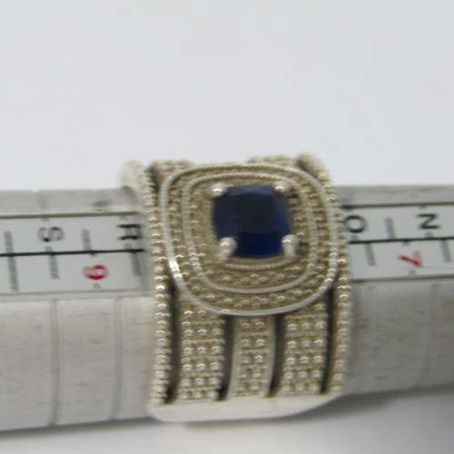 Sterling Silver ring with blue stone - weighs 7.5g - size Q/8