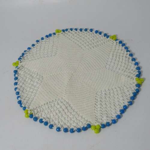 Old doily with blue and yellow beads handmade