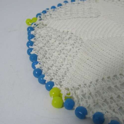 Old doily with blue and yellow beads handmade