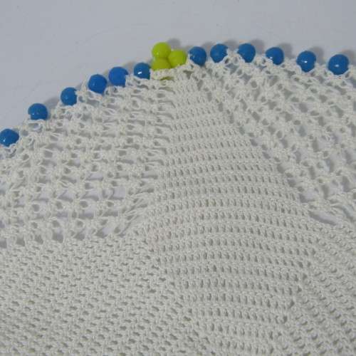 Old doily with blue and yellow beads handmade