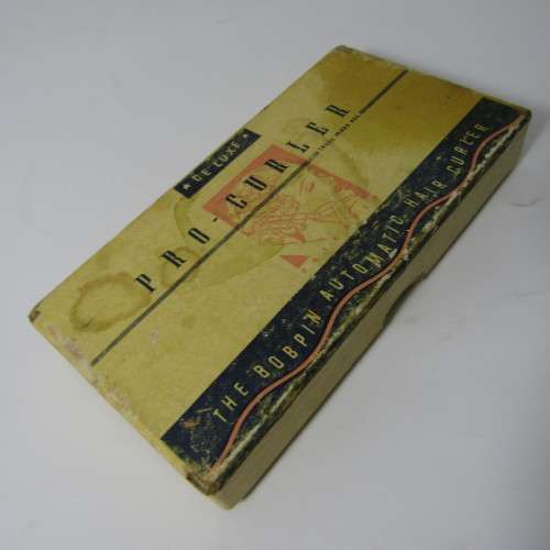 Vintage De Luxe Pro-Curler with metal hair clips