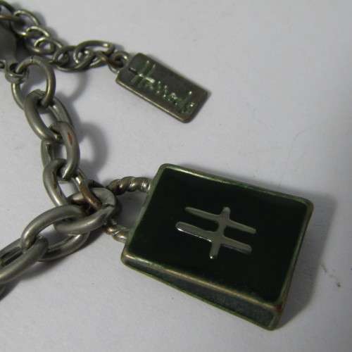 Harrods silver coloured charm bracelet