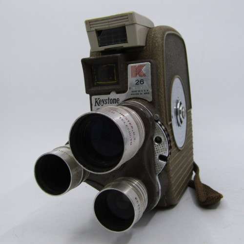 Vintage Keystone 8mm movie camera in damaged pouch - working