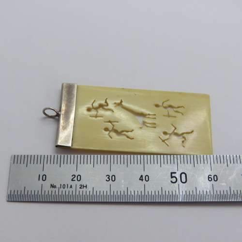 Sterling silver and faux ivory bushman carving motif pendant