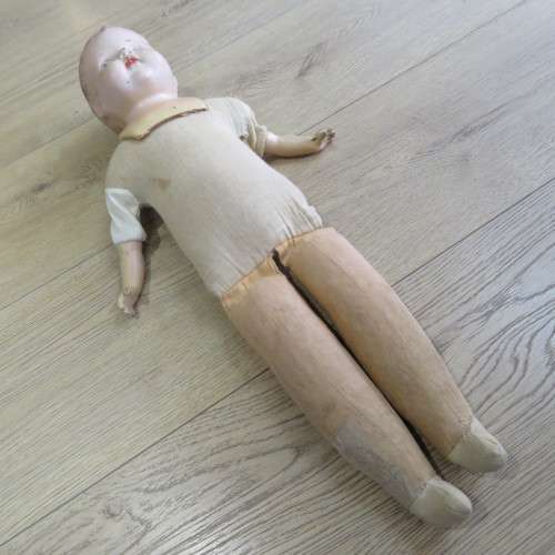 Antique Composition doll with soft body and legs - Some damage to fingers and head - Length 64 cm