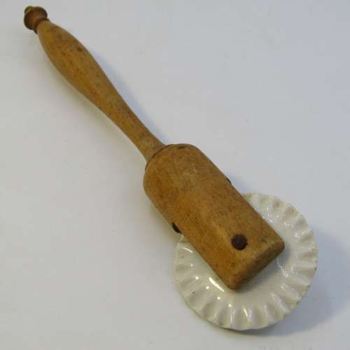 Antique porcelain and wood pastry rim roller