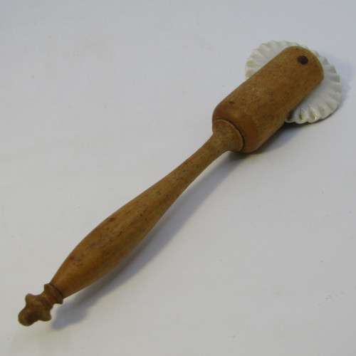 Antique porcelain and wood pastry rim roller