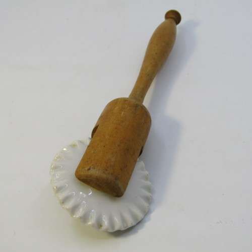 Antique porcelain and wood pastry rim roller