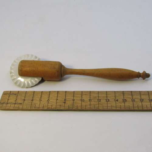 Antique porcelain and wood pastry rim roller