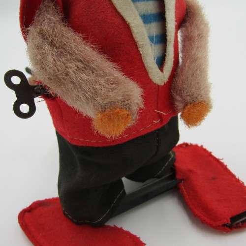 Vintage mechanical monkey toy that does back flips