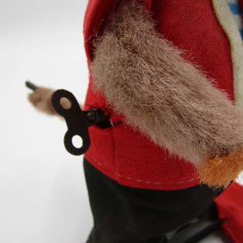 Vintage mechanical monkey toy that does back flips