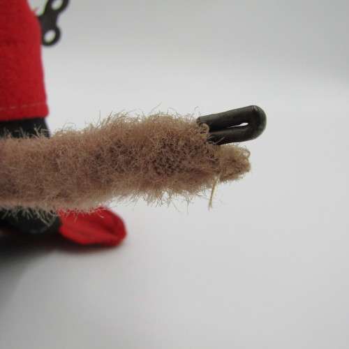 Vintage mechanical monkey toy that does back flips