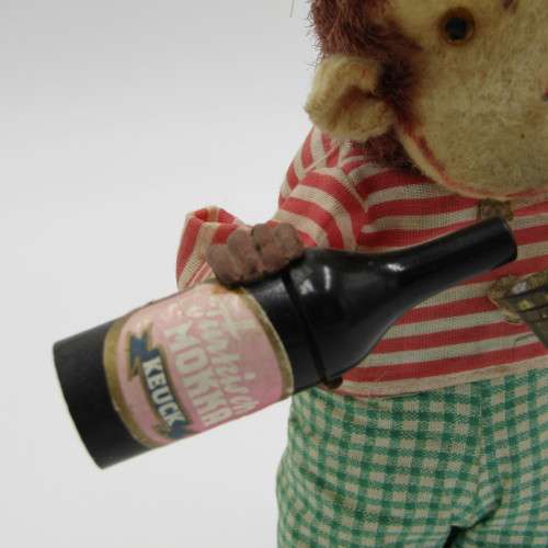 Vintage mechanical monkey toy - pouring a Vintage mechanical monkey toy