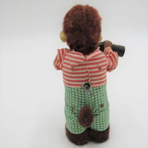 Vintage mechanical monkey toy - pouring a Vintage mechanical monkey toy