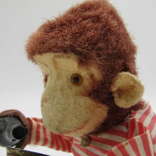 Vintage mechanical monkey toy - pouring a Vintage mechanical monkey toy