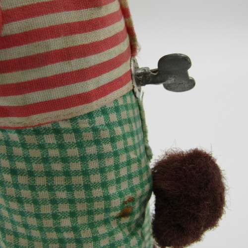 Vintage mechanical monkey toy - pouring a Vintage mechanical monkey toy