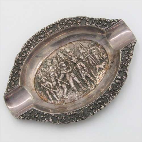 Silver ashtray with Musketeer theme in centre