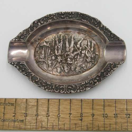 Silver ashtray with Musketeer theme in centre