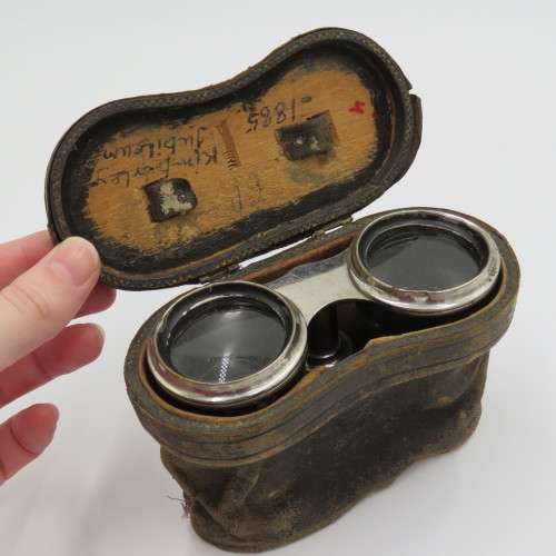 Antique pair of opera binoculars with leather pouch