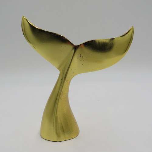 Gold coloured whale tail ornament