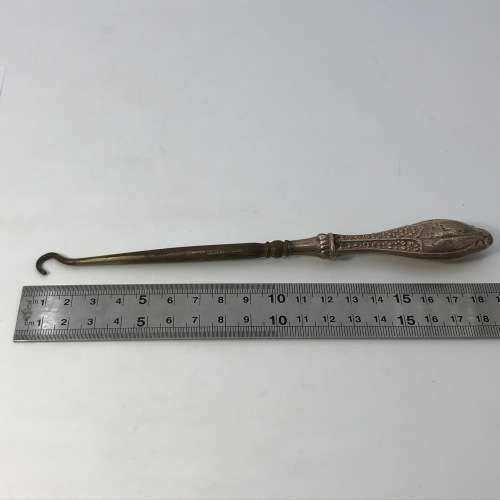 Boot lace puller with silver handle